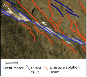 Pull-apart openings filled by calcite (Ca) between echelon thrust faults at low angle to bedding. Also present are cleavages at the contraction sides of the faults. Bays Mountain, Tennessee. For more details, see Ohlmacher and Aydin (1995).