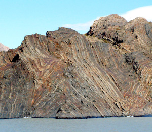 A series of anticline and syncline folds with a wavelength of several hundreds of meters in turbidite rocks exposed at the eastern boundary of Lago Grey, Chilean Patagonia.