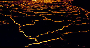 Fractures on the surface of a solidifying lava lake following the 1959 eruption of the Kilauea volcano on the Big Island of Hawaii. Note initial linear fractures with nearly orthogonal intersection angles on the surface.