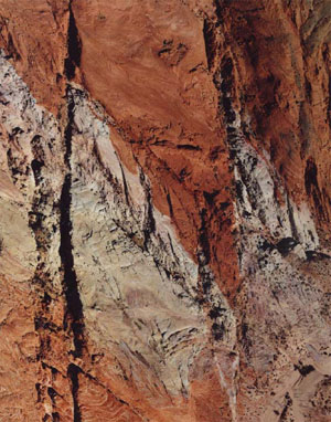 An aerial photograph of a series of strike-slip faults in Aztec Sandstone exposed at Valley of Fire State Park, Nevada. The faults are predominantly left-lateral as indicated by the offsets of the boundaries between the red and white sandstone units. The  left-lateral offset across the largest fault zone on the right-hand side is about 170 m. From Flodin and Aydin (2004).