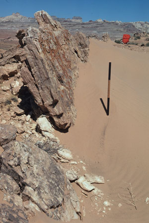 A shear band zone with about 4 m normal slip. Part of the scale bar above the sand is 75 cm. Goblin Valley, San Rafael Desert, UT. From Aydin and Johnson (1978).